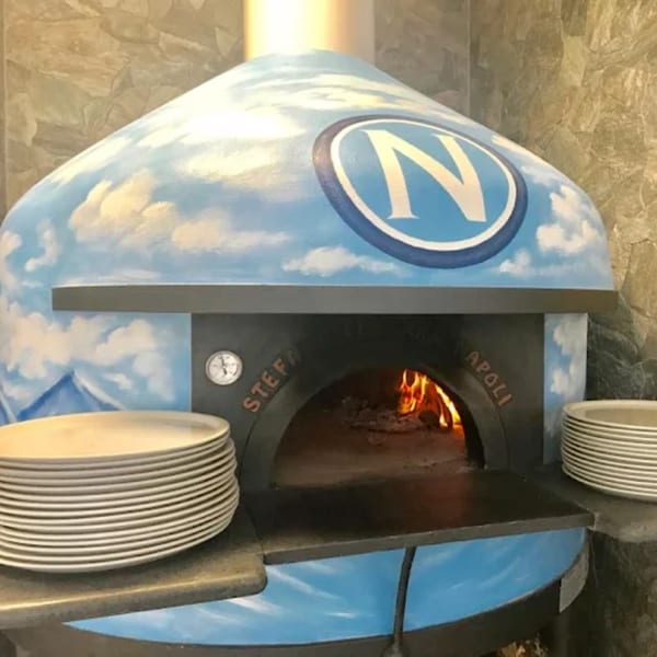 A blue and white wood-fired pizza oven with a large 'N' logo and flames inside.